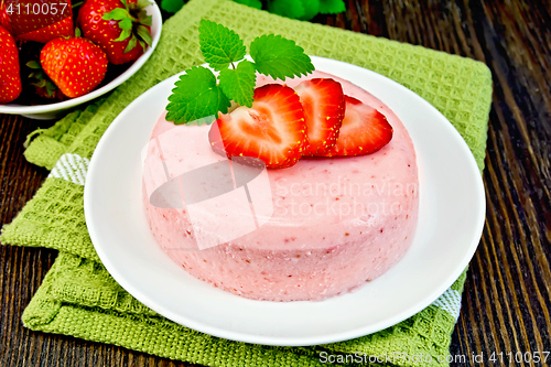 Image of Panna cotta strawberry on green napkin