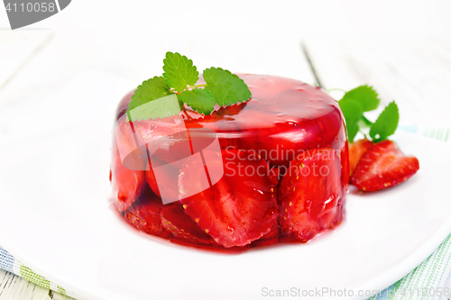 Image of Jelly strawberry with mint in plate on board