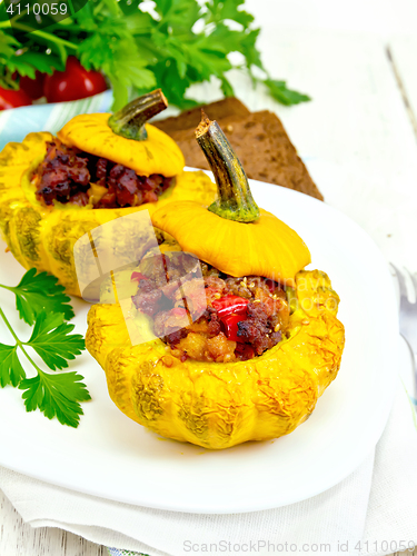 Image of Squash yellow stuffed with meat on board