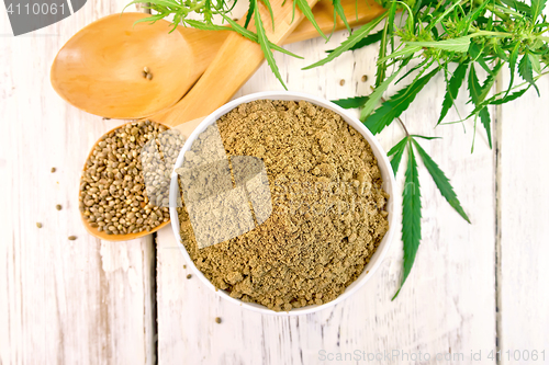 Image of Flour hemp in bowl with spoons on board top