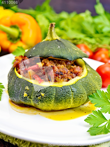 Image of Squash green stuffed with meat and vegetables on board
