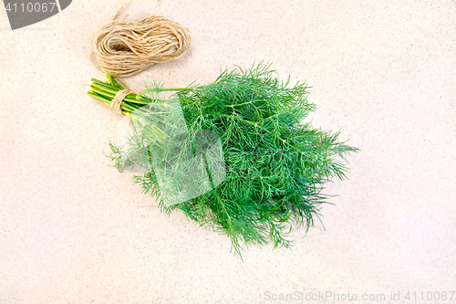 Image of Dill with twine on granite table top