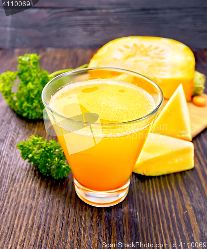 Image of Juice pumpkin with parsley on board