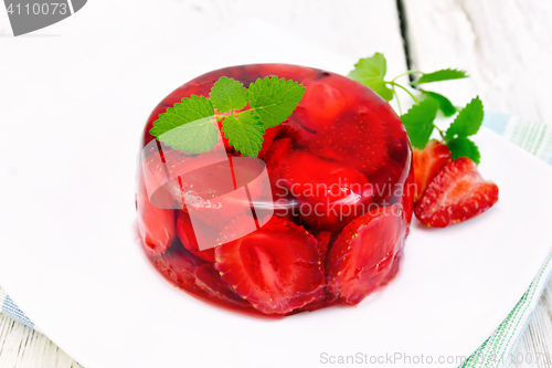 Image of Jelly strawberry with mint on napkin and board