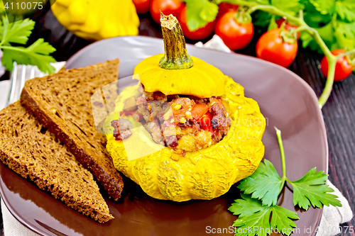 Image of Squash yellow stuffed with meat and vegetables on board