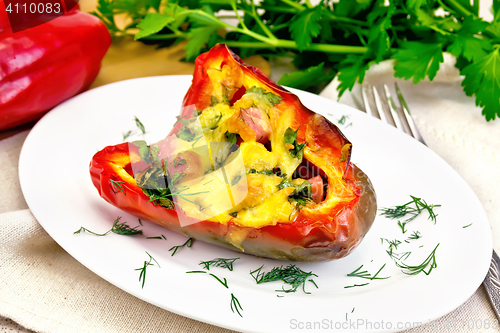 Image of Pepper stuffed with sausage and cheese on table