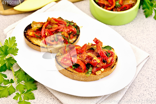Image of Bruschetta with vegetables in plate on table