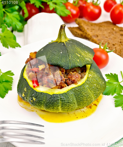 Image of Squash green stuffed with meat on light board