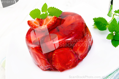 Image of Jelly strawberry with mint on napkin and light board