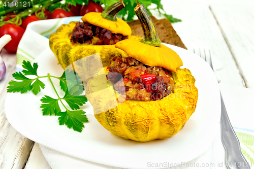 Image of Squash yellow stuffed in white plate on board