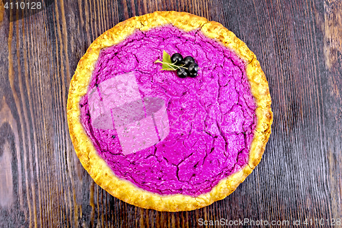 Image of Pie of black currants on dark board top