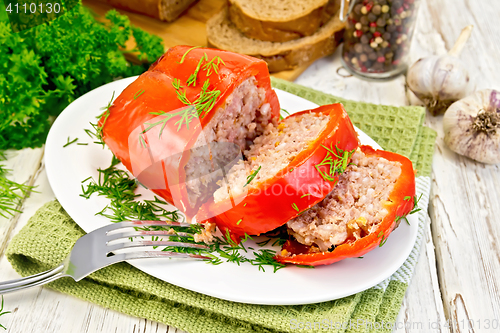 Image of Pepper stuffed meat in plate on board