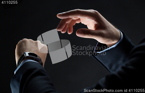 Image of close up of businessman hands with smart watch