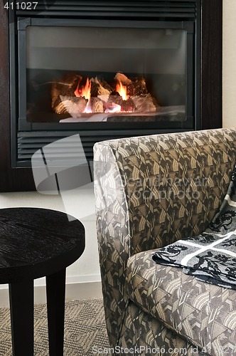 Image of Fireplace and armchair