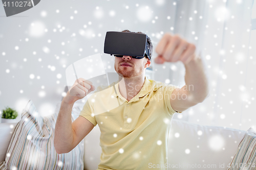 Image of young man in virtual reality headset or 3d glasses