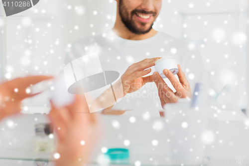 Image of close up of happy young man with cream at bathroom