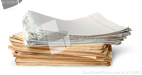 Image of In front stack of old yellowed sheets of school notebooks