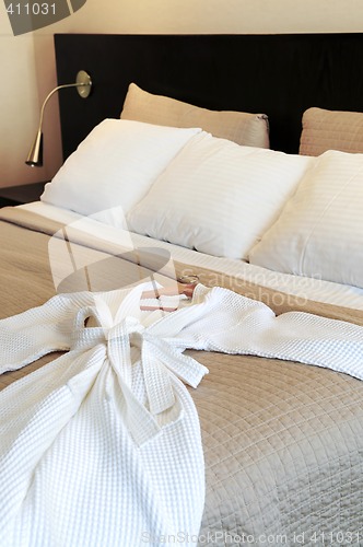 Image of Hotel bed with bathrobe
