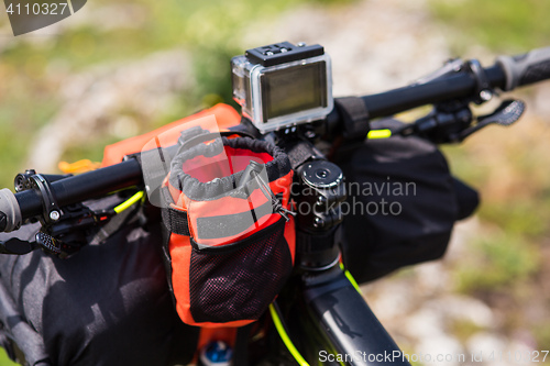 Image of Bicycle with orange bags for travel