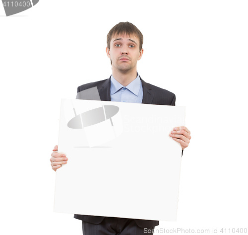 Image of sad businessman holding a white blank