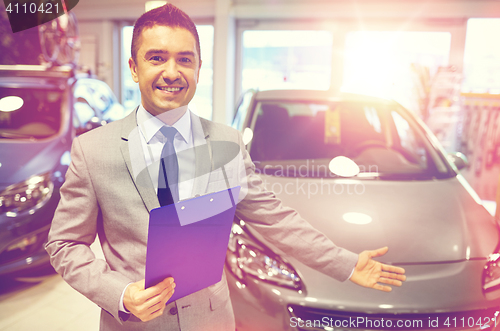 Image of happy man at auto show or car salon