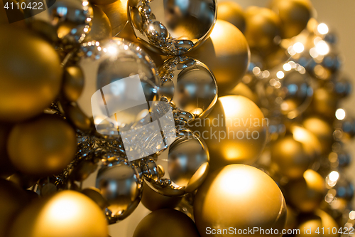 Image of golden christmas decoration or garland of beads