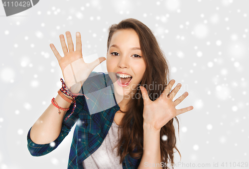 Image of happy laughing pretty teenage girl showing hands