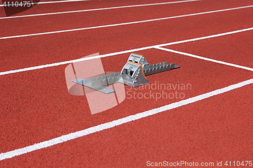 Image of Athletics starting blocks on race track