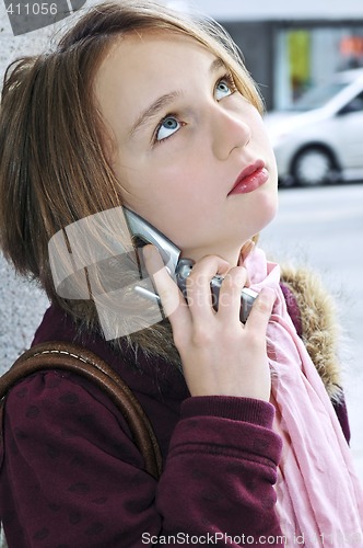 Image of Teenage girl talking on cell phone