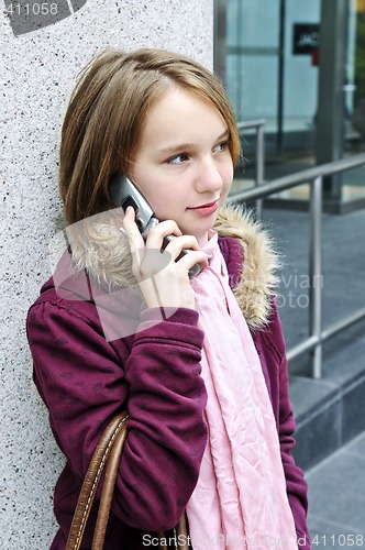 Image of Teenage girl talking on cell phone
