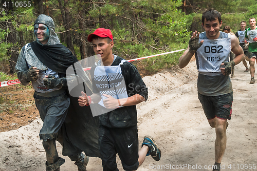 Image of Sportsmen run between stages in extrim race.Tyumen