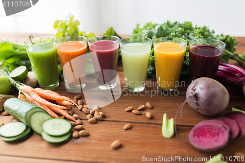 Image of glasses with different fruit or vegetable juices