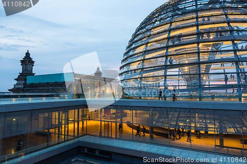 Image of Illuminated glass dome on the roof of the Reichstag in Berlin at dusk.