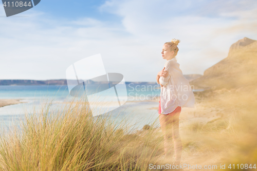 Image of Free Happy Woman Enjoying Last Autumn Sun on Vacations.