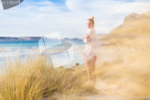 Image of Free Happy Woman Enjoying Last Autumn Sun on Vacations.