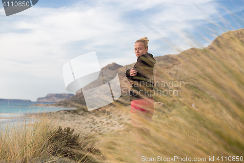 Image of Free Happy Woman Enjoying Last Autumn Sun on Vacations.