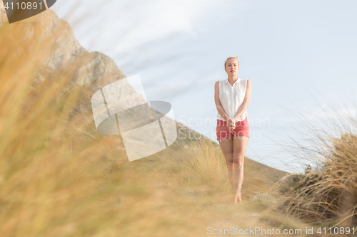 Image of Free Happy Woman Enjoying Last Autumn Sun on Vacations.