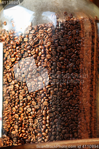 Image of coffee beans in glass container