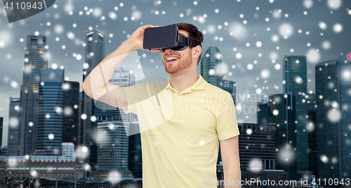 Image of happy man in virtual reality headset or 3d glasses