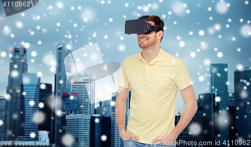 Image of happy man in virtual reality headset or 3d glasses