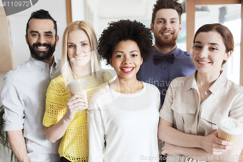 Image of happy creative team in office