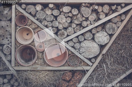 Image of Wood on a shelf in a woodshed