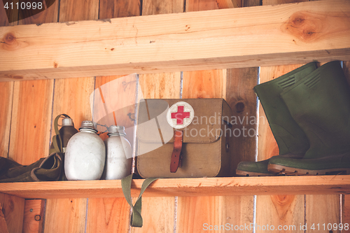 Image of Retro medic equipment on an old wooden shelfe