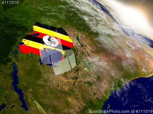 Image of Uganda with flag in rising sun