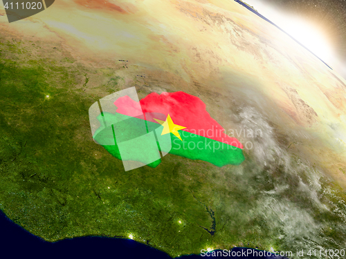 Image of Burkina Faso with flag in rising sun