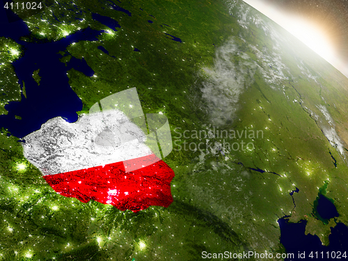 Image of Poland with flag in rising sun