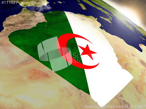 Image of Algeria with flag in rising sun