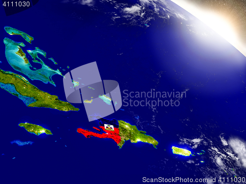 Image of Haiti with flag in rising sun