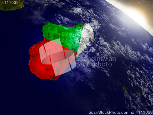 Image of Madagascar with flag in rising sun