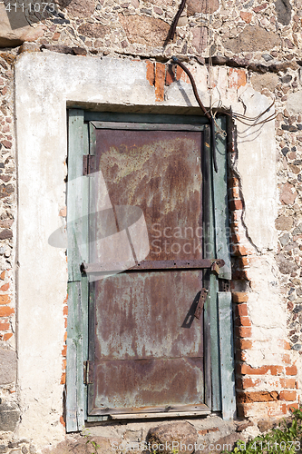 Image of old iron door of the building